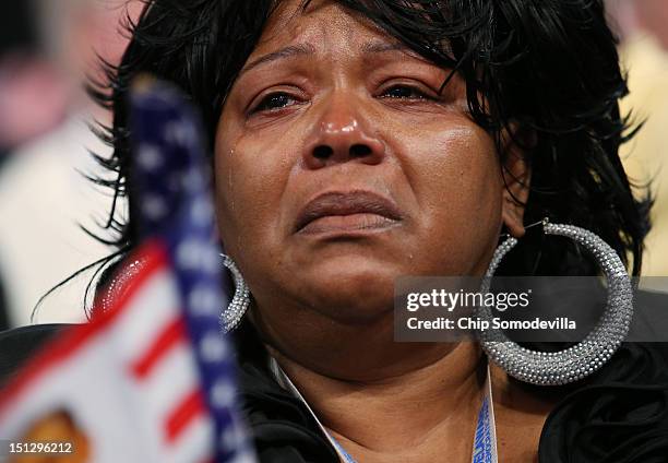 Woman reacts as Chair of the Congressional Black Caucus, U.S. Rep. Emanuel Cleaver, II speaks during day two of the Democratic National Convention at...