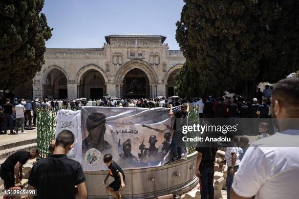 Poster in support of the city of Jenin, which was raided by Israel, is seen ahead of Friday prayer at Al-Aqsa Mosque Compound in Jerusalem on July 7,...