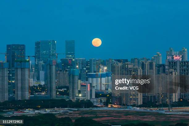 Full moon rises in the sky on July 3, 2023 in Xiamen, Fujian Province of China. It is the lowest full moon of the year and the lowest since 2006.