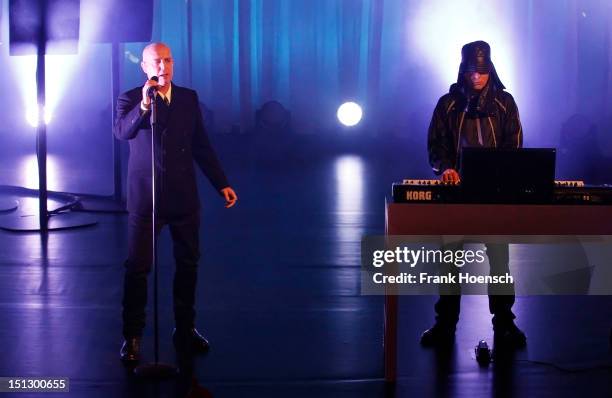 Singer Neil Tennant and Chris Lowe of Pet Shop Boys perform live during a concert at the Hebbel am Ufer on September 5, 2012 in Berlin, Germany.