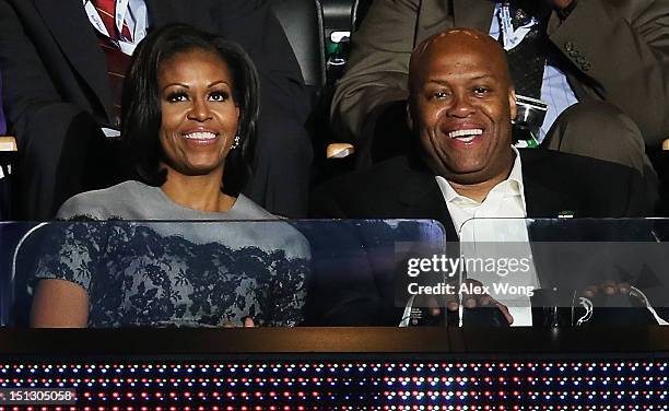 First lady Michelle Obama sits with her brother Craig Robinson in a box during day two of the Democratic National Convention at Time Warner Cable...