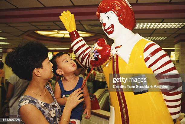 Statue of clown mascot Ronald McDonald at a McDonald's restaurant in Shenzhen, China, 1993.