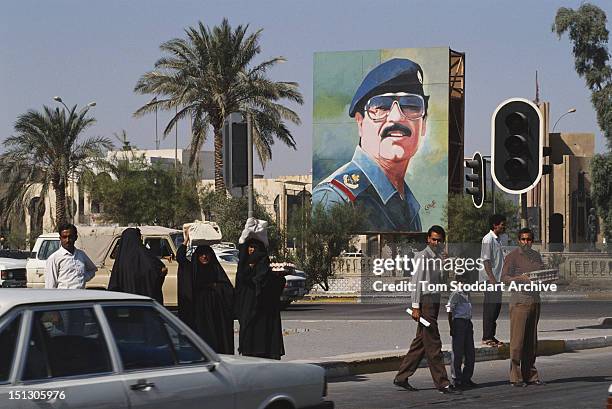 Sadam R 2 A large mural depicting President Saddam Hussein in a Baghdad street ...