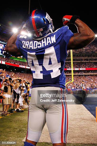 Running back Ahmad Bradshaw of the New York Giants reacts after scoring a touchdown in the third quarter against the Dallas Cowboys during the 2012...