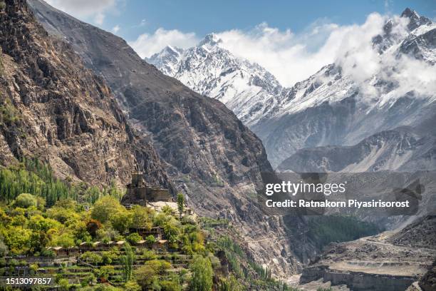 snow cap mountain and landscape of hunza valley with cherry blossom and karakoram range mountain, hunza valley, gilgit-baltistan, north of pakistan. - karimabad hunza stock pictures, royalty-free photos & images