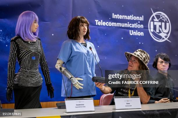 Robot frontwoman "Desdemona", healthcare assistant robot "Grace", SingularityNET CEO Ben Goertzel and tele-operated android "Geminoid HI-2" attend...