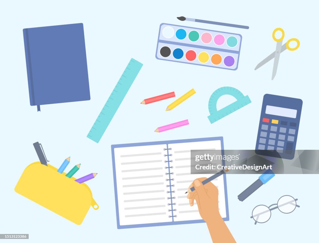High Angle View Of Student Table With School Stationery. Student Doing Homework. Back To School Concept