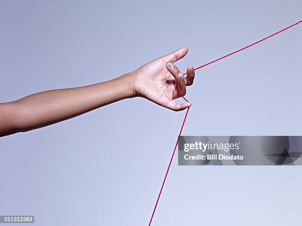 girls hand pulling string - 手を引く �ストックフォトと画像