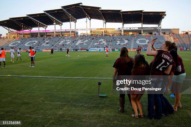 Olympic swimming gold medalist Missy Franklin and her Regis High School classmates watch warm ups as they attend the match between the Portland...