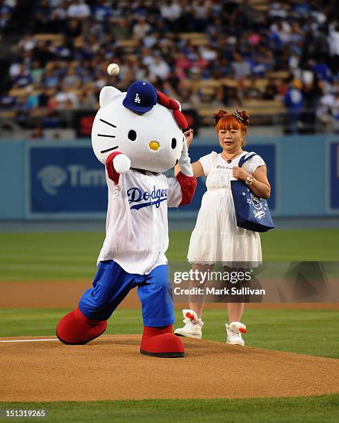 Hello Kitty" designer Yuko Yamaguchi watches "Hello Kitty" throw out the ceremonial first pitch at Dodger Stadium on September 5, 2012 in Los...