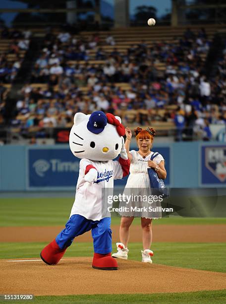 Hello Kitty" designer Yuko Yamaguchi watches "Hello Kitty" throw out the ceremonial first pitch at Dodger Stadium on September 5, 2012 in Los...
