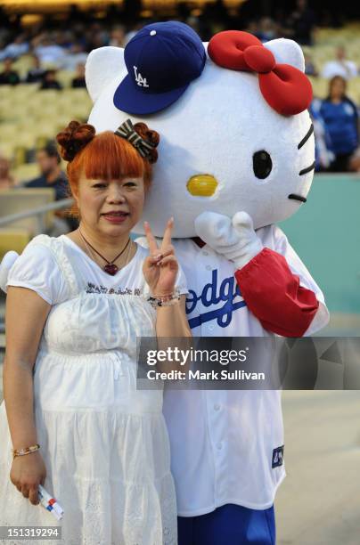Hello Kitty" designer Yuko Yamaguchi and "Hello Kitty" pose at Dodger Stadium on September 5, 2012 in Los Angeles, California.