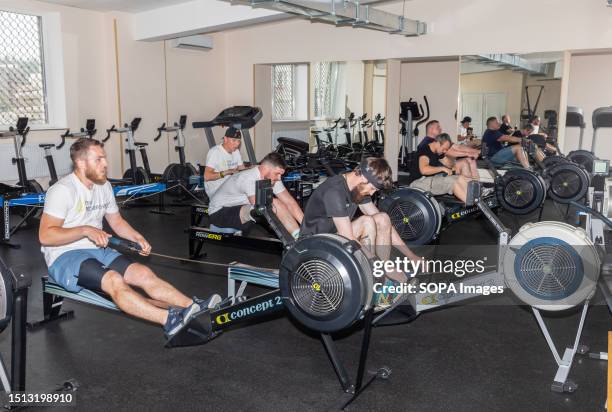 Group of athletes are seen doing strength-training on exercise equipment at the gym. Training and preparing disabled athletes for the international...