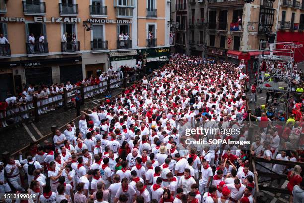 Participants take part in the traditional San Fermin festival. People ran in front of the bulls in the first running of the bulls of the San Fermin...