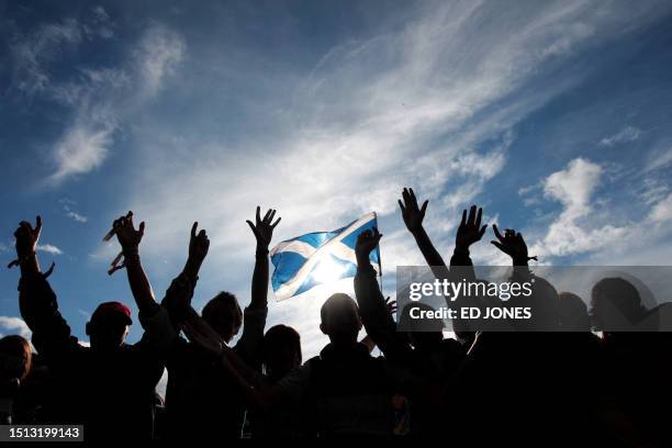 Fans watch British musician Newton Faulkner perform at 'T in the Park' music festival at Balado airfield near Kinross in Scotland, on July 11, 2008....