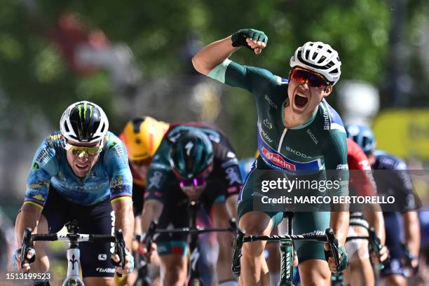 Alpecin-Deceuninck's Belgian rider Jasper Philipsen cycles ahead of Astana Qazaqstan Team's British rider Mark Cavendish to the finish line to win...