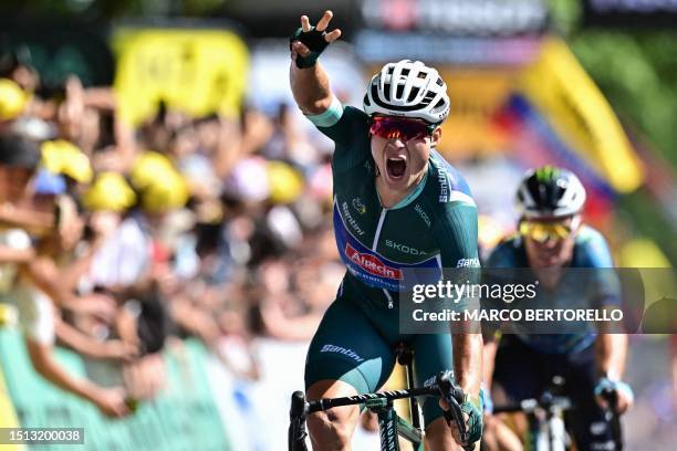 Alpecin-Deceuninck's Belgian rider Jasper Philipsen cycles ahead of Astana Qazaqstan Team's British rider Mark Cavendish to the finish line to win...