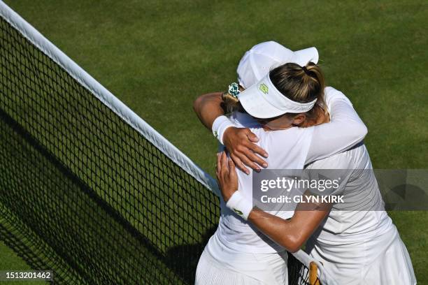 Ukraine's Lesia Tsurenko hugs Romania's Ana Bogdan after winning during their women's singles tennis match on the fifth day of the 2023 Wimbledon...