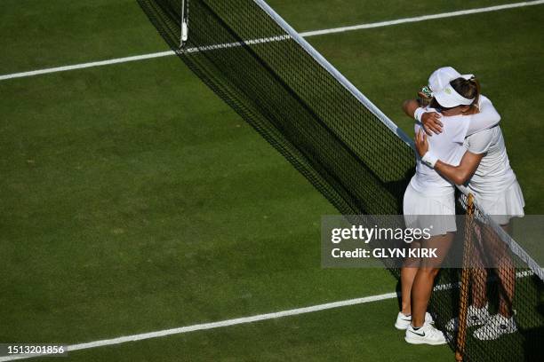 Ukraine's Lesia Tsurenko hugs Romania's Ana Bogdan after winning during their women's singles tennis match on the fifth day of the 2023 Wimbledon...