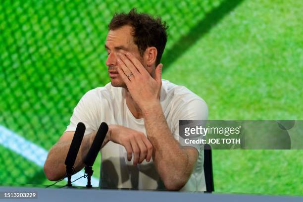 Britain's Andy Murray reacts as he speaks during a press conference after his defeat against Greece's Stefanos Tsitsipas in their men's singles...