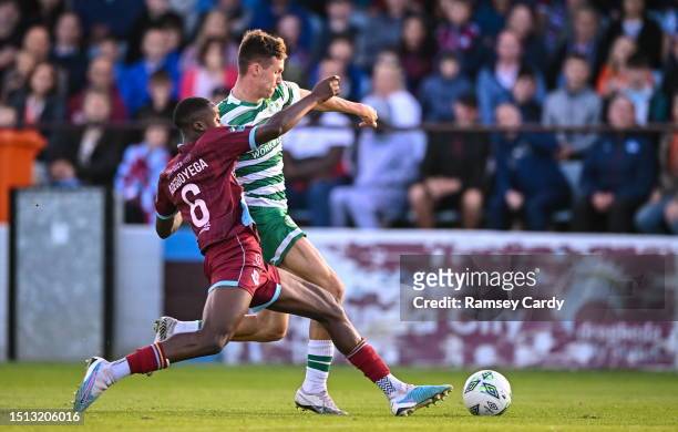 Louth , Ireland - 7 July 2023; Johnny Kenny of Shamrock Rovers is tackled by Emmanuel Adegboyega of Drogheda United during the SSE Airtricity Men's...