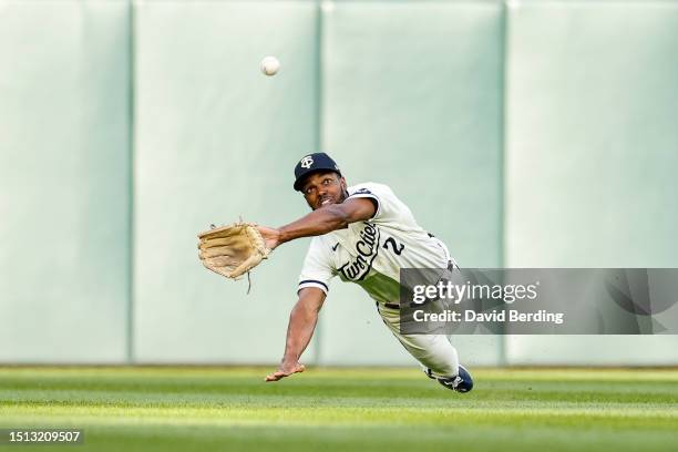 Michael A. Taylor of the Minnesota Twins dives to catch a fly ball hit by Gunnar Henderson of the Baltimore Orioles for an out in the first inning at...