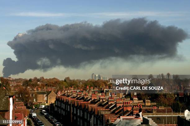 Large plume of smoke rises above east London, 12 November 2007. A fire broke out in an old bus garage in east London on Monday, police said, sending...