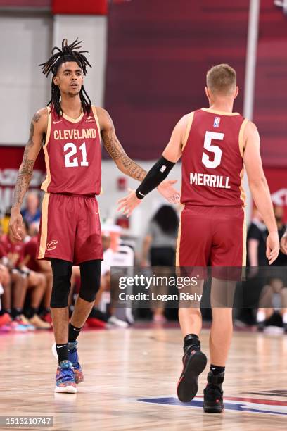 Emoni Bates of the Cleveland Cavaliers high five Sam Merrill of the Cleveland Cavaliers during the game against the Brooklyn Nets during the 2023 NBA...