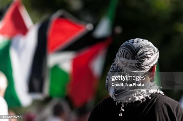 People participate in the demonstration called by the Palestinian community and young Palestinians in Italy in solidarity with the resistance in...