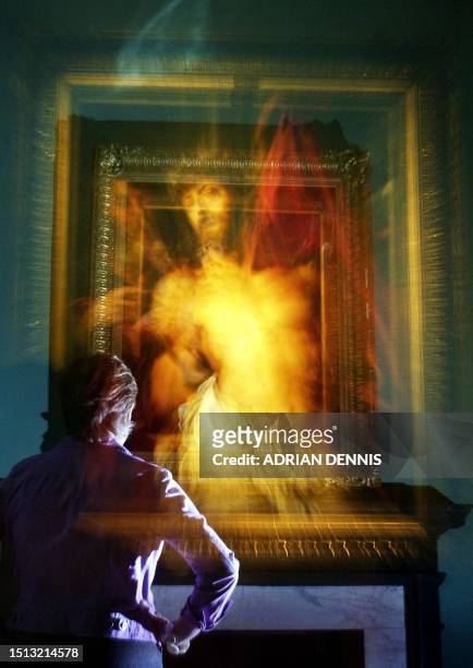 Visitor examines "The Crown of Thorns" a Rubens painting during the opening of the "Touch of Brilliance" exhibition at Somerset House in London 17...