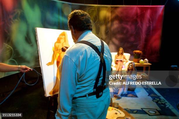 An artist paints a naked model during the recording of the program "The City with Sex", produced by Dr. Ruben Carbajal 28 May, 2002. The program,...