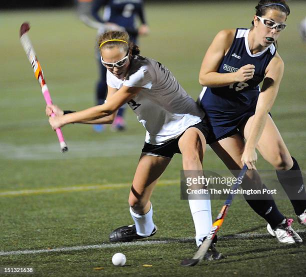 November 2- Westfield Mid Emily McNamara fires a shot on goal as South County def Daisy Thomas gets her stick on the ball during 2nd half action on...