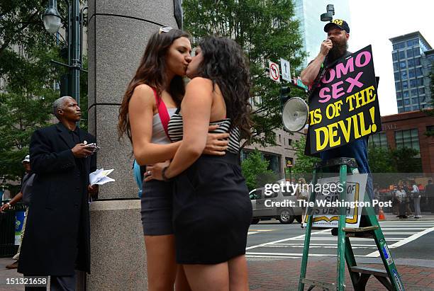 Chrissy Chambers and Bria Kam upstage an religious, anti-gay protestors on the downtown streets near the Democratic National Convention in Charlotte,...