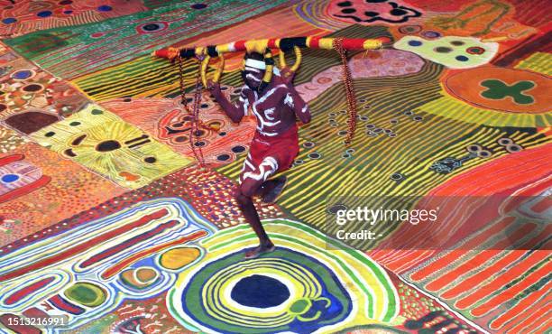 Walmajarri Aborigine from the remote Kimberley region of northwestern Australia performs a traditional dance in Canberra 30 March on an 8x10 metre...