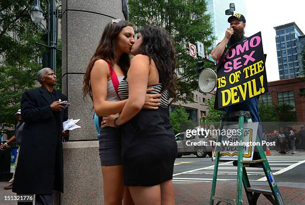 Chrissy Chambers and Bria Kam upstage an religious, anti-gay protestors on the downtown streets near the Democratic National Convention in Charlotte,...
