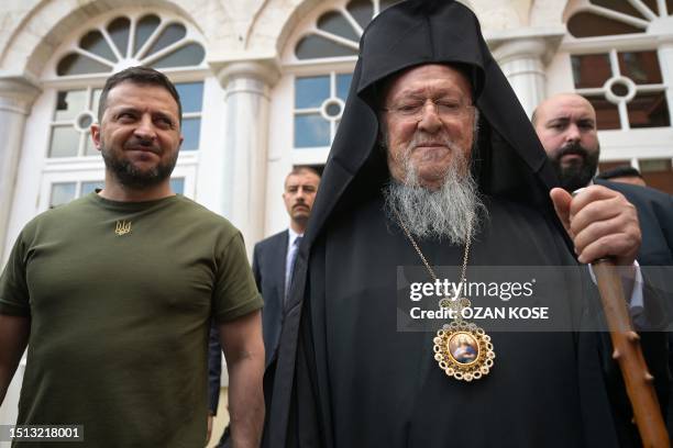 Ecumenical Patriarch Bartholomew I and Ukraine's President Volodymyr Zelensky leave after the celebration of a special mass at the Patriarchal Church...