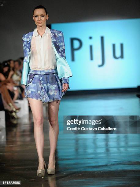 Model walks the runway at the NYFW S/S 2013: "PIJU" Collection Launch at New York Fashion Palette at Dream Downtown on September 5, 2012 in New York...