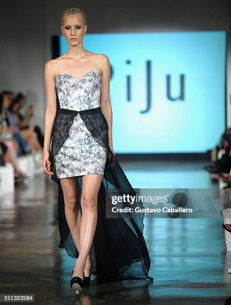 Model walks the runway at the NYFW S/S 2013: "PIJU" Collection Launch at New York Fashion Palette at Dream Downtown on September 5, 2012 in New York...