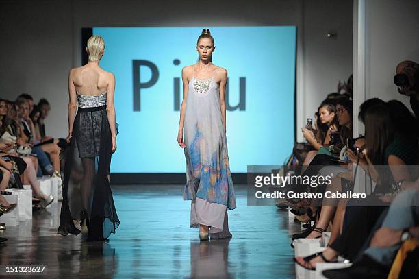 Model walks the runway at the NYFW S/S 2013: "PIJU" Collection Launch at New York Fashion Palette at Dream Downtown on September 5, 2012 in New York...