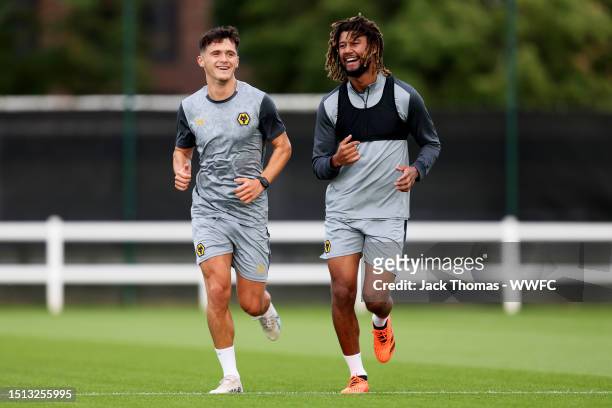 Ryan Giles and Dion Sanderson of Wolverhampton Wanderers in action during a Wolverhampton Wanderers training session as they return to Compton for...
