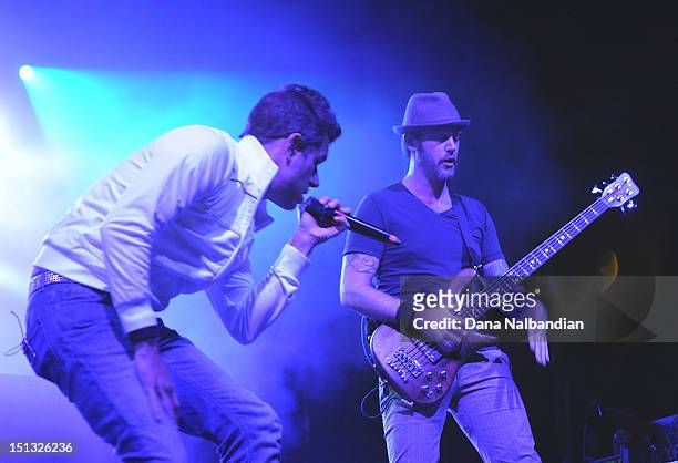 Singer Nick Hexum and bass player Aaron "P-Nut" Wills of 311 peform at Marymoor Amphitheater on September 5, 2012 in Redmond, Washington.