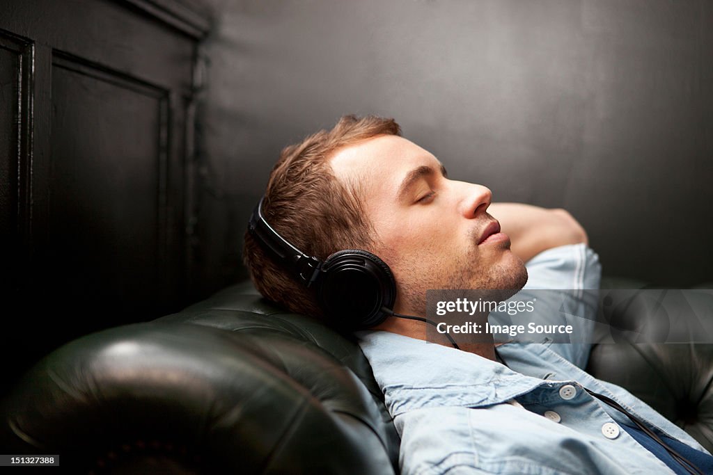 Man wearing headphones listening to music