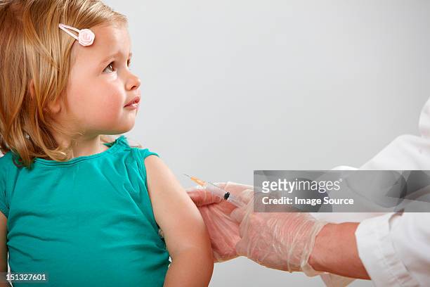 girl having injection - children vaccination stock pictures, royalty-free photos & images