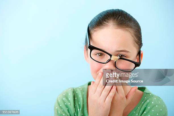 girl wearing broken glasses - broken spectacles stock pictures, royalty-free photos & images
