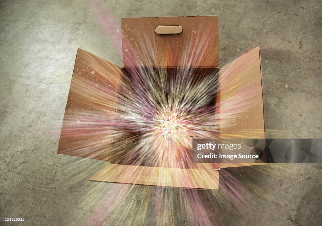 Open cardboard box with sparks