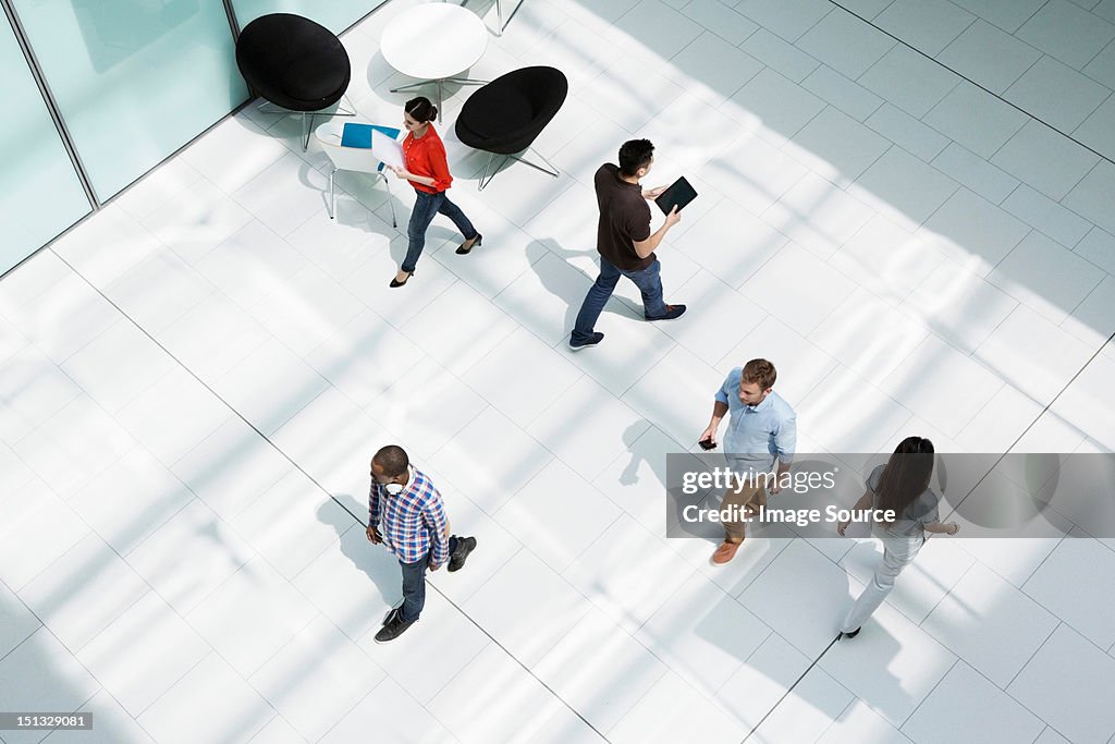 People walking on office concourse