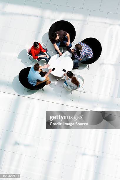 overhead view of colleagues in meeting - five people meeting stock pictures, royalty-free photos & images