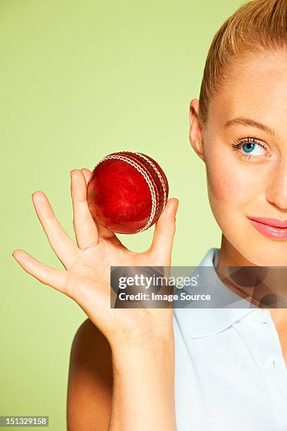 young woman holding cricket ball - cricket england women stock pictures, royalty-free photos & images