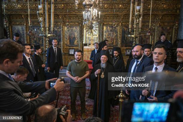 Ecumenical Patriarch Bartholomew I and Ukraine's President Volodymyr Zelensky pose after the celebration of a special mass at the Patriarchal Church...