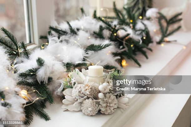 new year's decor on the windowsill. new year. christmas. - candle white background stock-fotos und bilder